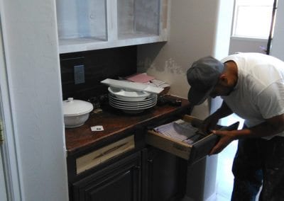 A man working on a drawer front