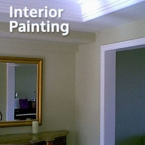 An image of crown molding, wall and door frame depicting an Interior Painting Service